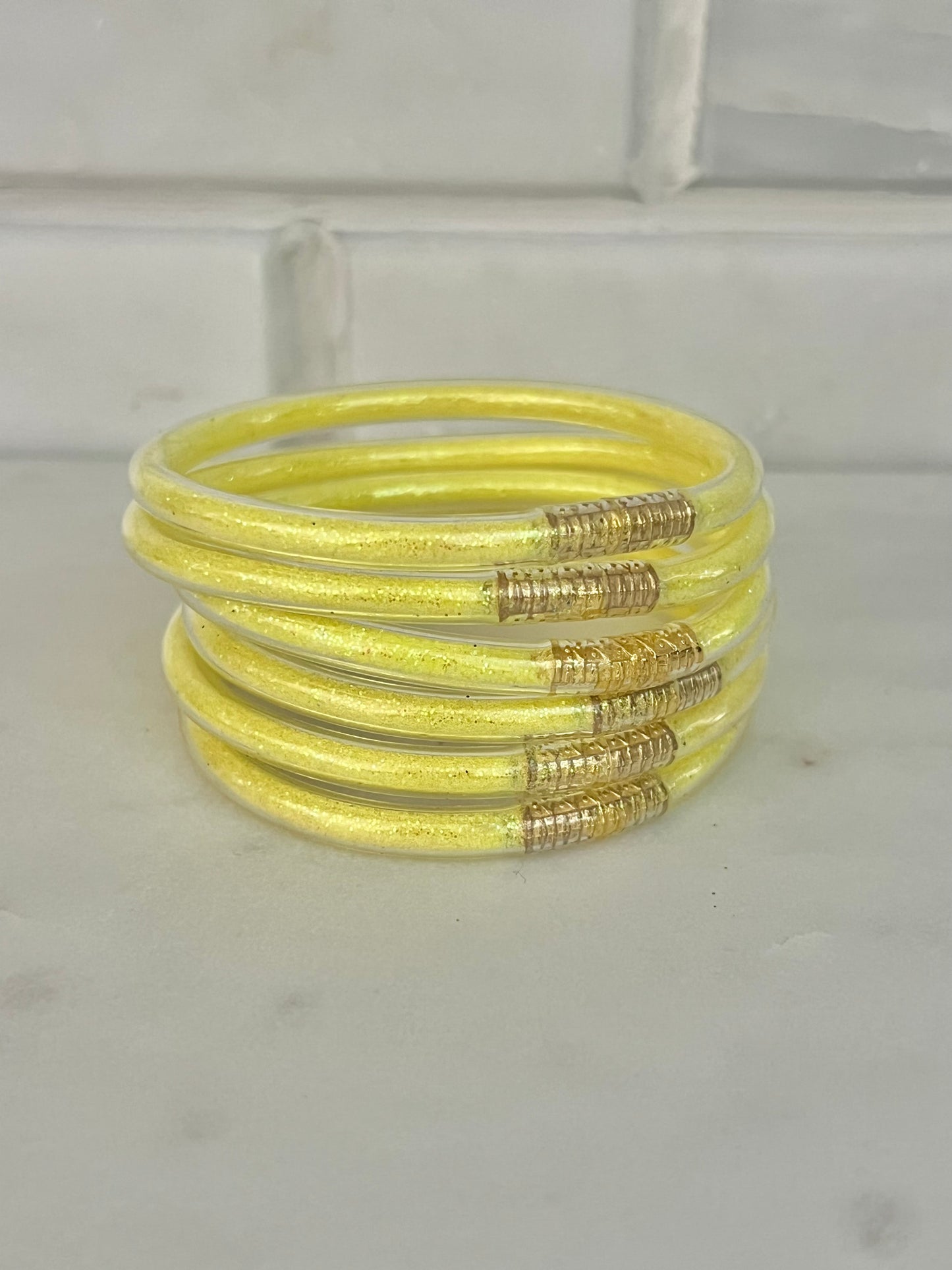 All weather neon yellow bangles