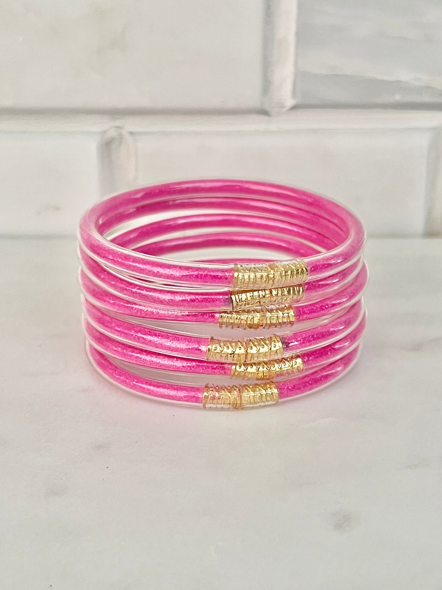 All weather neon pink bangles