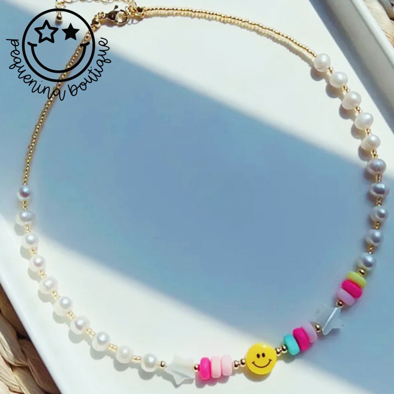 Smiley pearl necklace